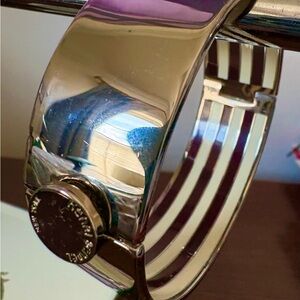 Henri Bendel bangle silver tone with signature brown/white stripes
